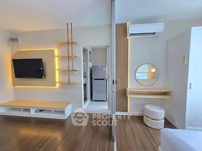 Modern living room with stylish decor and open kitchen layout