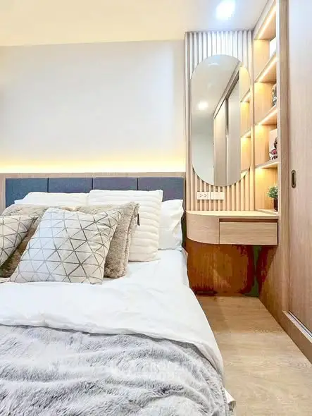 Modern bedroom with stylish decor and cozy bedding