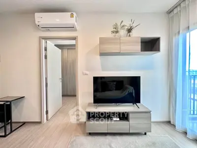 Modern living room with sleek furniture and air conditioning in a bright apartment.