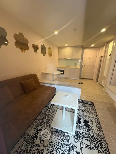 Modern living room with stylish decor and open kitchen layout