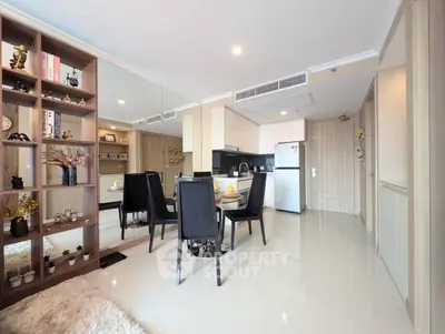 Modern open-plan living and dining area with sleek kitchen and stylish decor