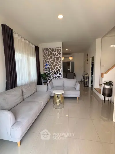 Spacious modern living room with elegant decor and natural light