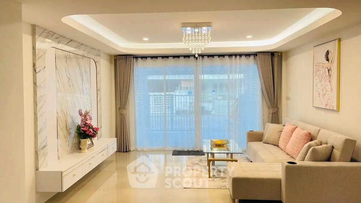 Elegant living room with modern decor and large window view