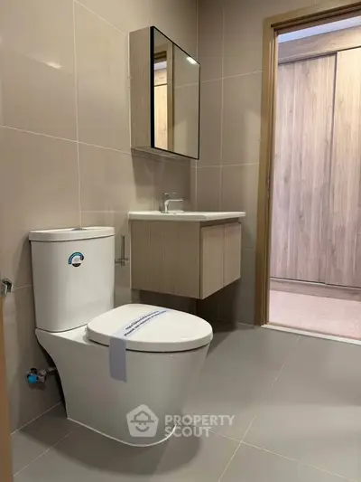 Modern bathroom with sleek fixtures and neutral tones
