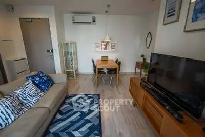 Charming living room with modern decor and cozy seating area.