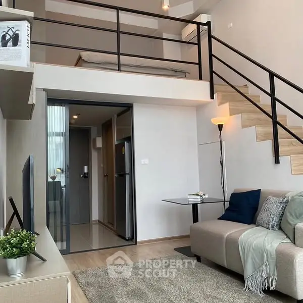 Modern loft apartment with stylish mezzanine bedroom and cozy living area.