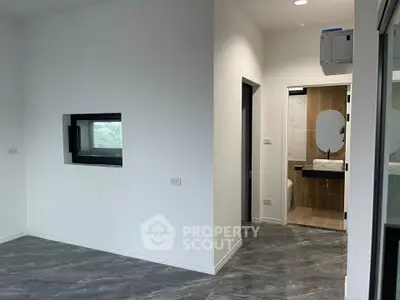 Modern interior with sleek bathroom and stylish flooring, perfect for contemporary living.