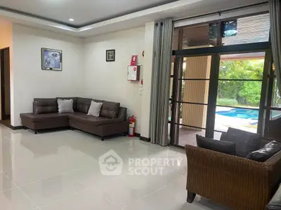 Spacious living room with pool view and elegant decor