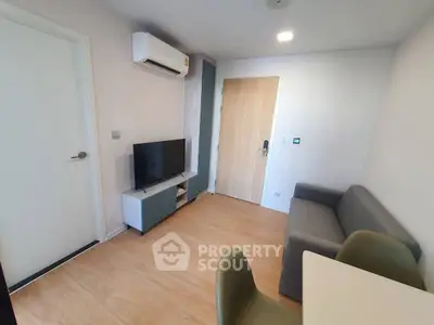 Modern living room with sleek furniture and air conditioning, perfect for cozy urban living.