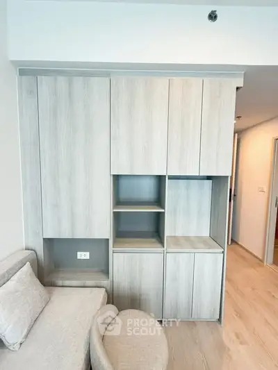 Modern living room with stylish built-in storage and cozy seating area