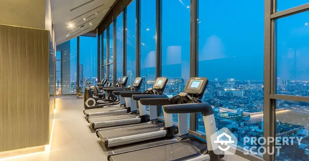 Luxury high-rise gym with panoramic city views and modern equipment