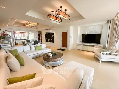 Luxurious modern living room with elegant decor and spacious seating area.