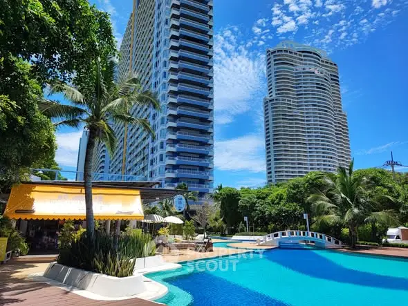 Luxurious high-rise buildings with a stunning pool and lush greenery, perfect for upscale urban living.