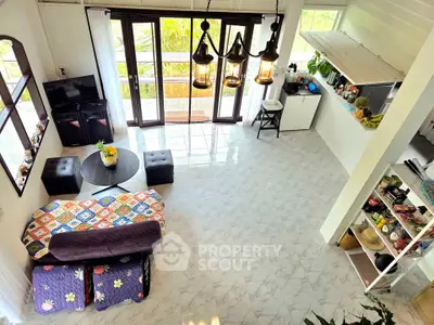 Spacious living room with modern decor and open kitchen layout