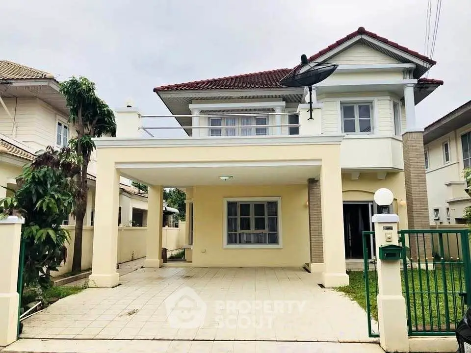 Charming two-story house with a spacious driveway and modern exterior design, perfect for family living.