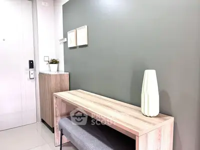 Modern entryway with sleek bench and minimalist decor in stylish apartment.