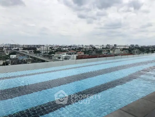 Stunning rooftop infinity pool with panoramic city views, perfect for luxury living.