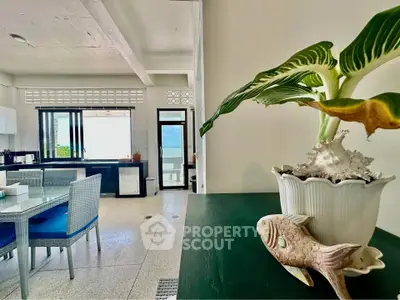 Bright and airy living space with modern decor and ocean view, perfect for relaxation and entertaining.