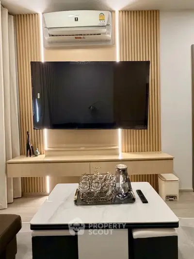 Modern living room with sleek TV setup and elegant decor