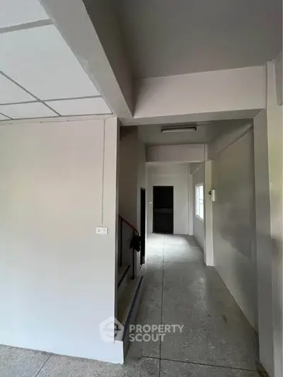 Spacious hallway with modern design and neutral tones, ideal for customization.
