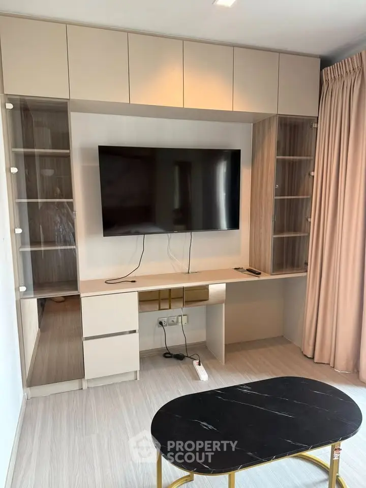 Modern living room with sleek TV unit and elegant furnishings