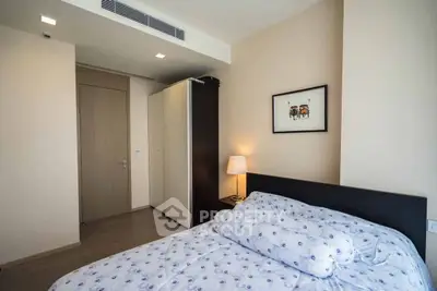 Cozy bedroom with modern decor and soft lighting