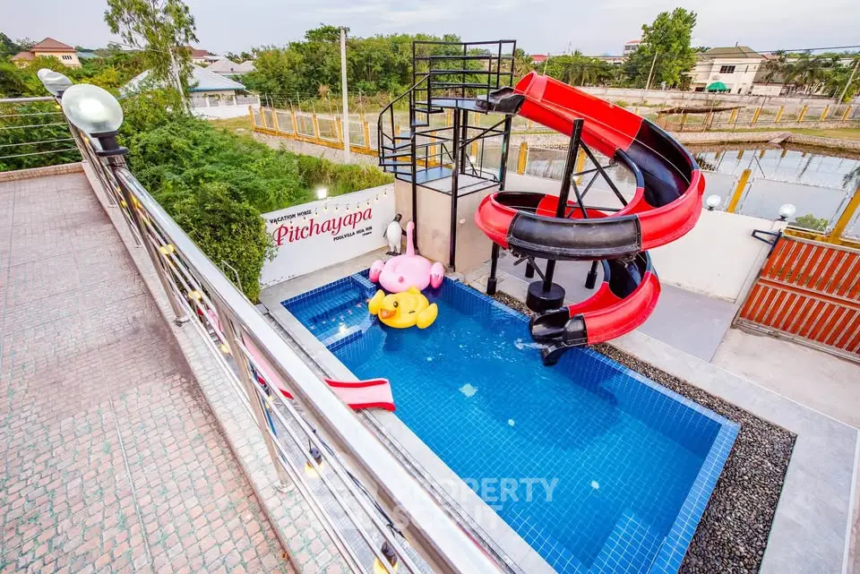 Charming property with a fun pool slide and vibrant outdoor play area, perfect for family enjoyment.