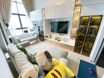 Luxurious living room with high ceilings, plush sofa, and elegant decor in modern apartment.