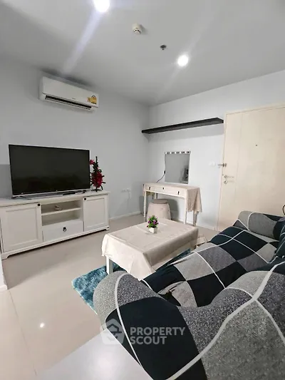 Modern living room with stylish decor and entertainment center
