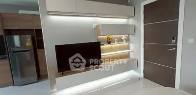 Modern living room with sleek TV unit and ambient lighting