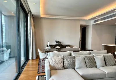 Spacious modern living room with large windows and elegant decor