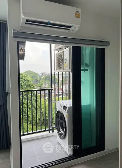 Modern apartment balcony with washing machine and scenic view