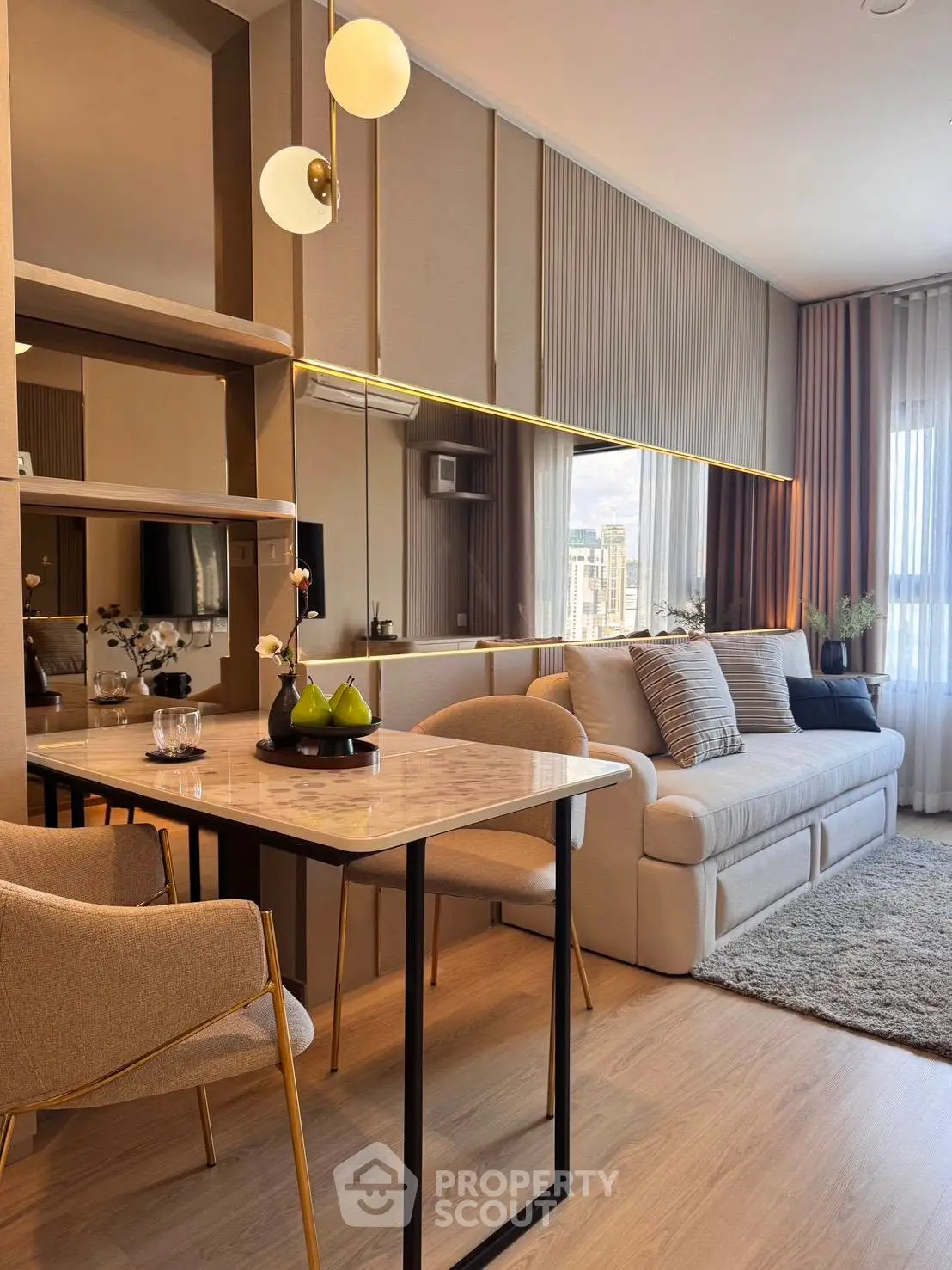 Modern living room with elegant decor and city view, featuring a cozy sofa and stylish dining area.