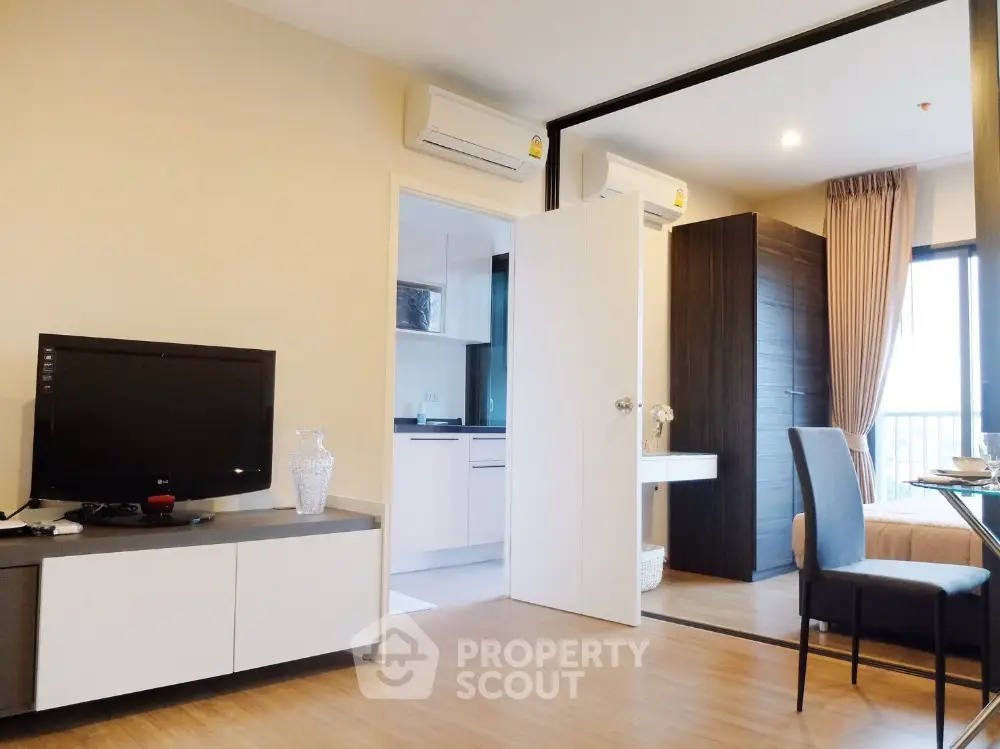 Modern open-plan living room with dining area and kitchen in stylish apartment