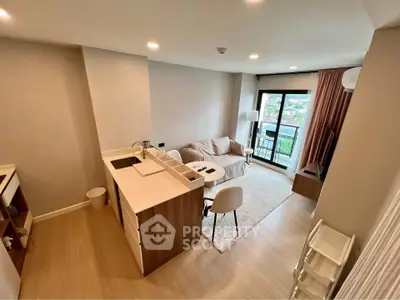 Modern open-plan living room with kitchen and balcony view