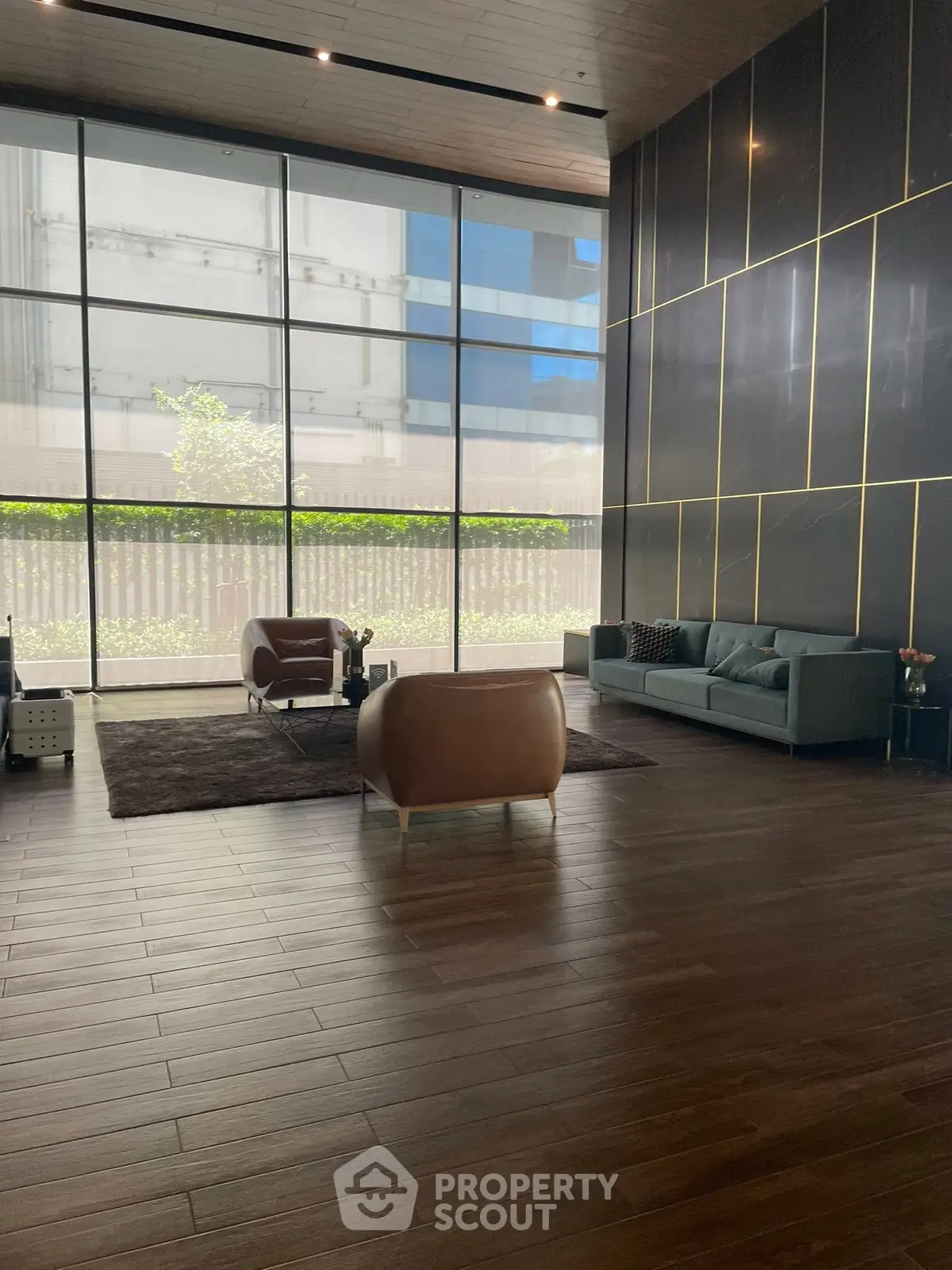 Luxurious modern living room with high ceilings and large windows