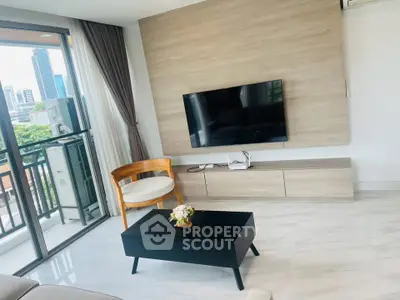 Modern living room with sleek design and city view balcony