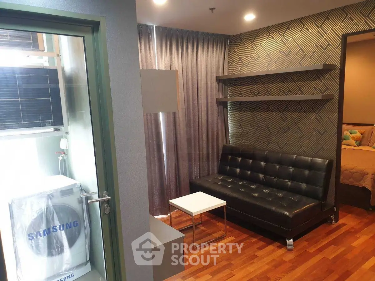Modern living room with stylish decor and washing machine in cozy apartment