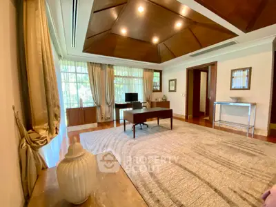 Luxurious living room with elegant decor and large windows