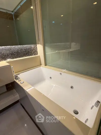 Luxurious bathroom with modern bathtub and elegant design features.