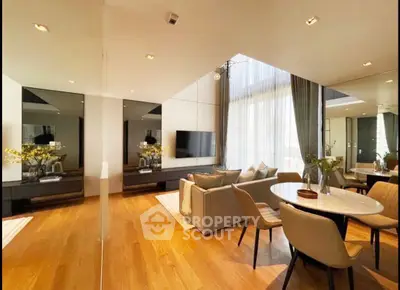 Luxurious modern living room with elegant dining area and floor-to-ceiling windows.