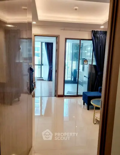 Modern apartment entrance with glossy floors and stylish decor