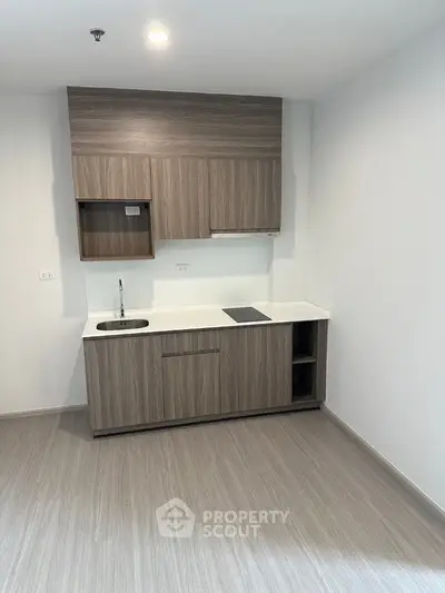 Modern minimalist kitchen with sleek cabinetry and compact design