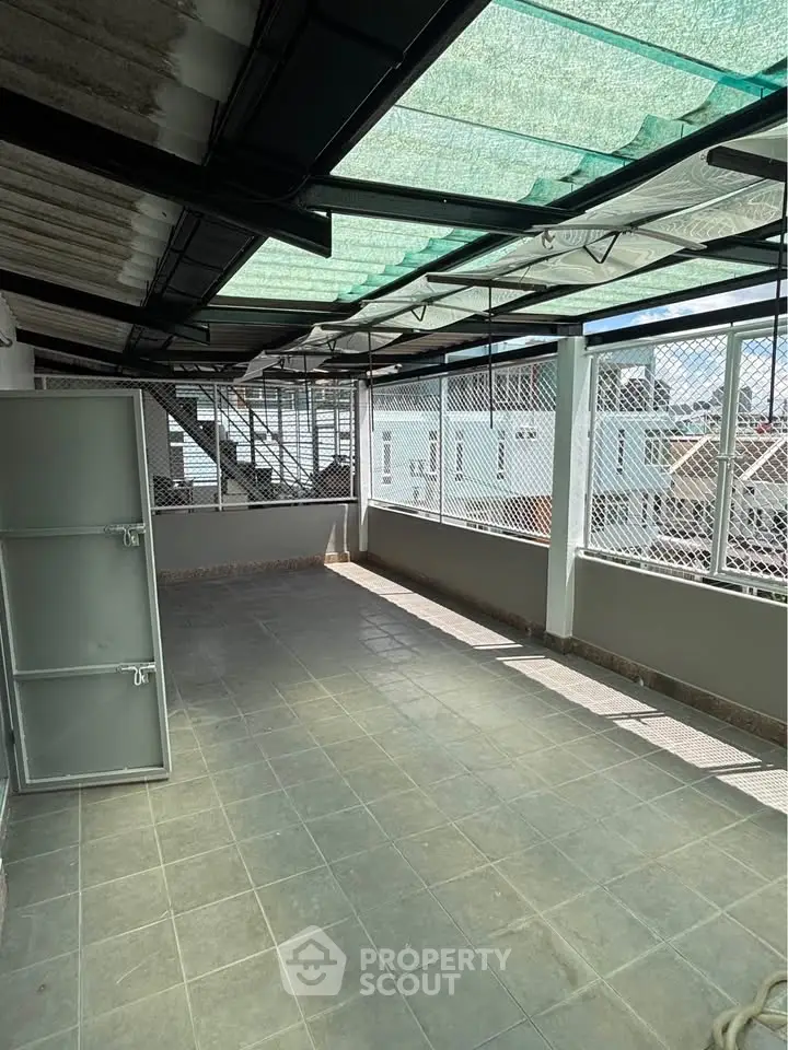 Spacious rooftop terrace with modern design and city views, perfect for relaxation and entertainment.