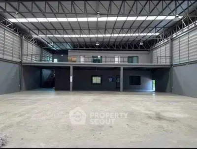 Spacious industrial warehouse with mezzanine level and high ceilings
