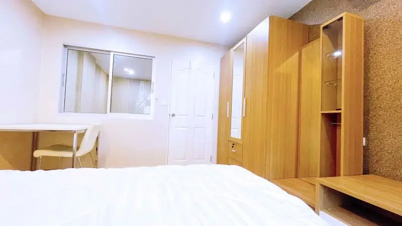 Modern bedroom with wooden furniture and cozy ambiance