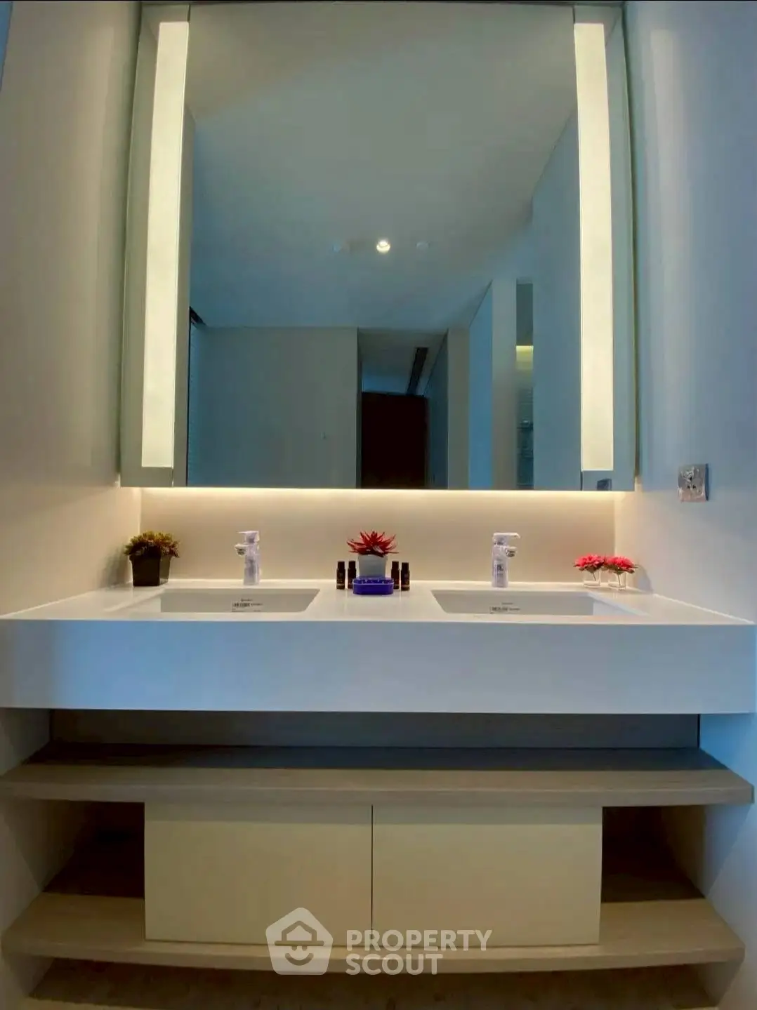 Modern bathroom with dual sinks and elegant lighting