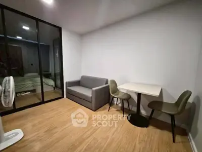 Modern living room with cozy sofa and dining area in stylish apartment