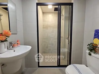 Modern bathroom with sleek shower enclosure and stylish fixtures