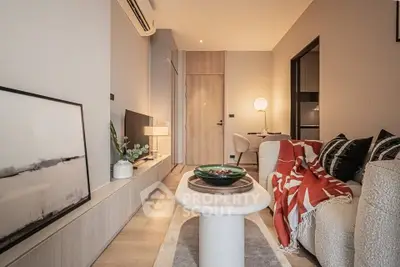 Stylish modern living room with cozy decor and ambient lighting, perfect for relaxation and entertainment.